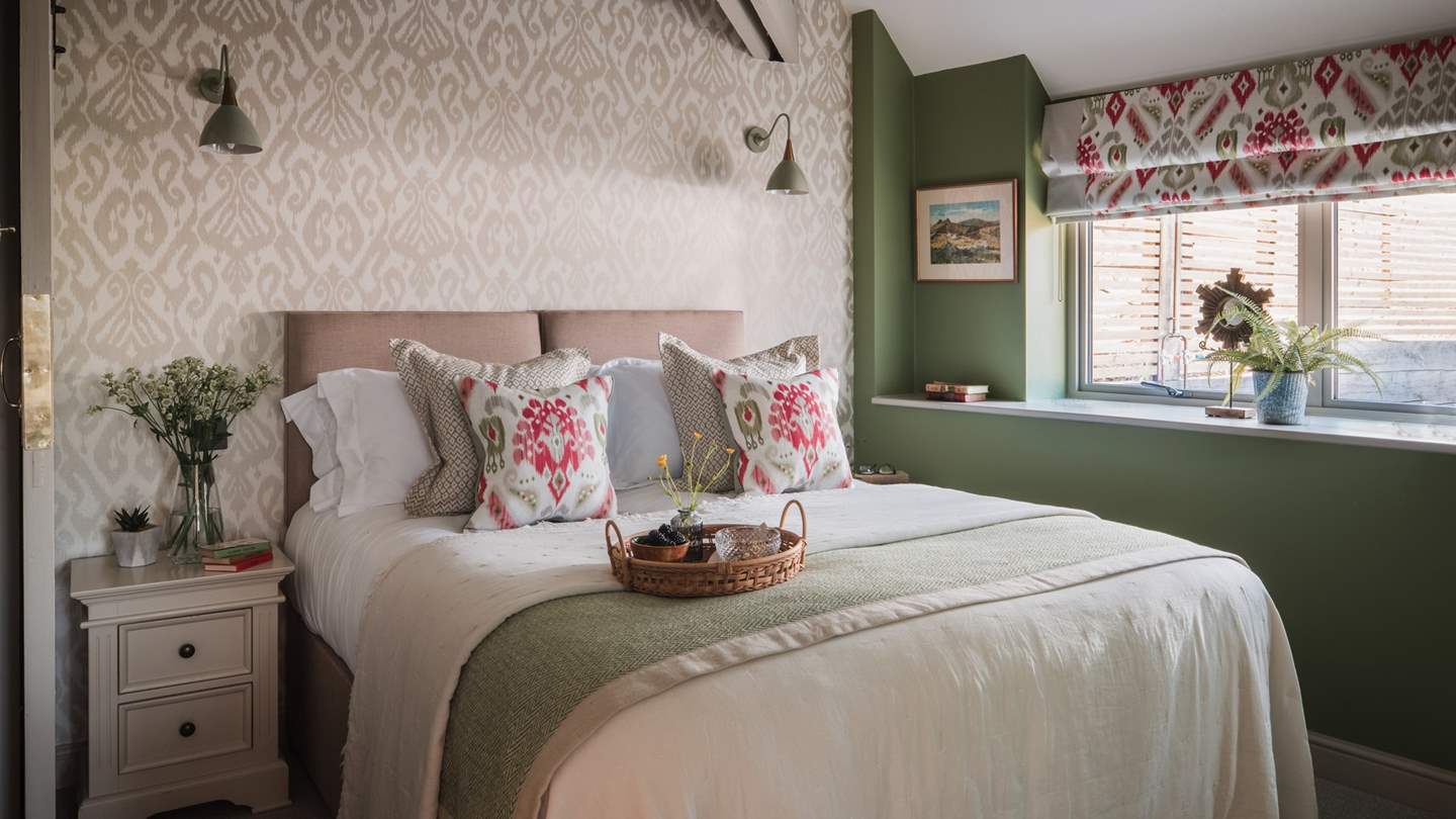 A zip-and-link king size bed can be found in the third bedroom, dressed in soft earthy tones