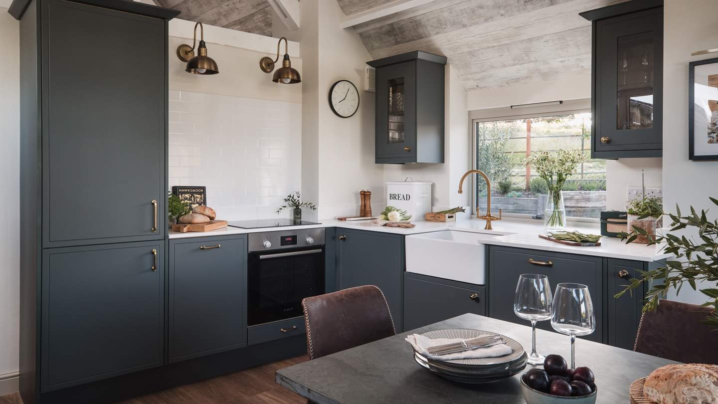 Enjoy idyllic countryside vistas from the bright and airy kitchen, with tall, vaulted ceilings