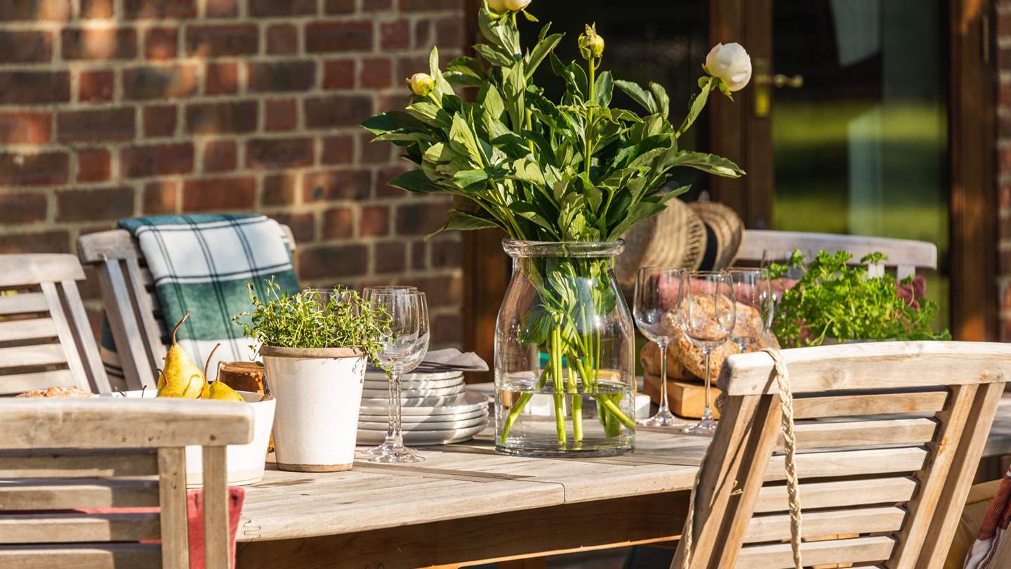 A Weber charcoal BBQ and firepit adding a spark to your al fresco moments