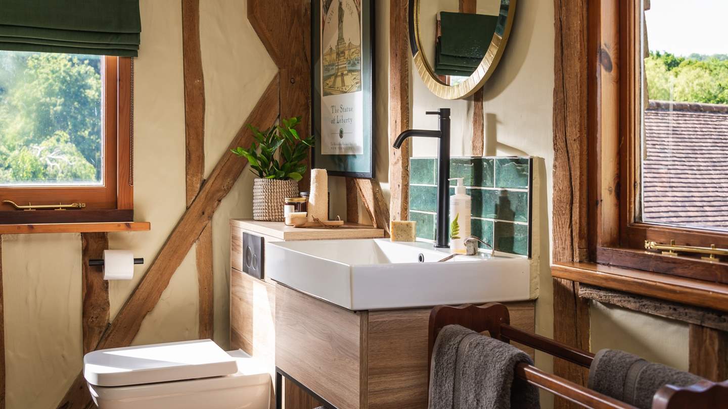 Soothing neutral tones with splashes of emerald green throughout