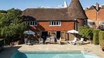 Whether you want to linger on one of the oh-so-comfy loungers, sip cocktails in the wicker seating area, or bathe in the refreshing waters as you take in your verdant surrounds