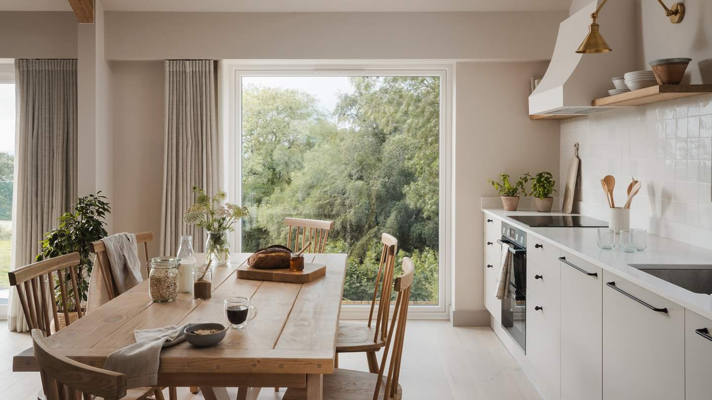 For divine mealtimes in your Boutique abode, a large, reclaimed wood table with six chairs provides a dreamy space to dine together