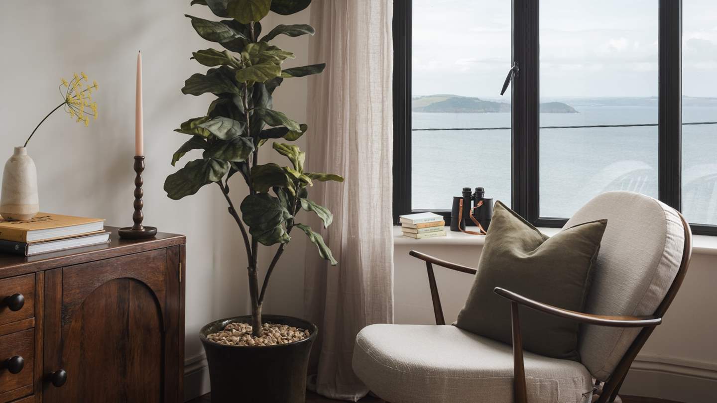 This heavenly room adorned with antique paintings and furniture promises jaw-dropping views over Mevagissey's harbour