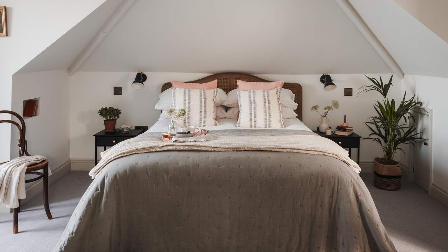 Wander to the top floor to uncover the darling master bedroom