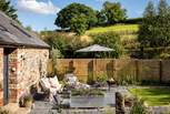 The enclosed garden promises a tranquil haven for moments of rest outdoors 