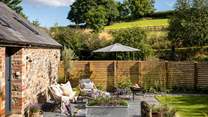 The enclosed garden promises a tranquil haven for moments of rest outdoors 