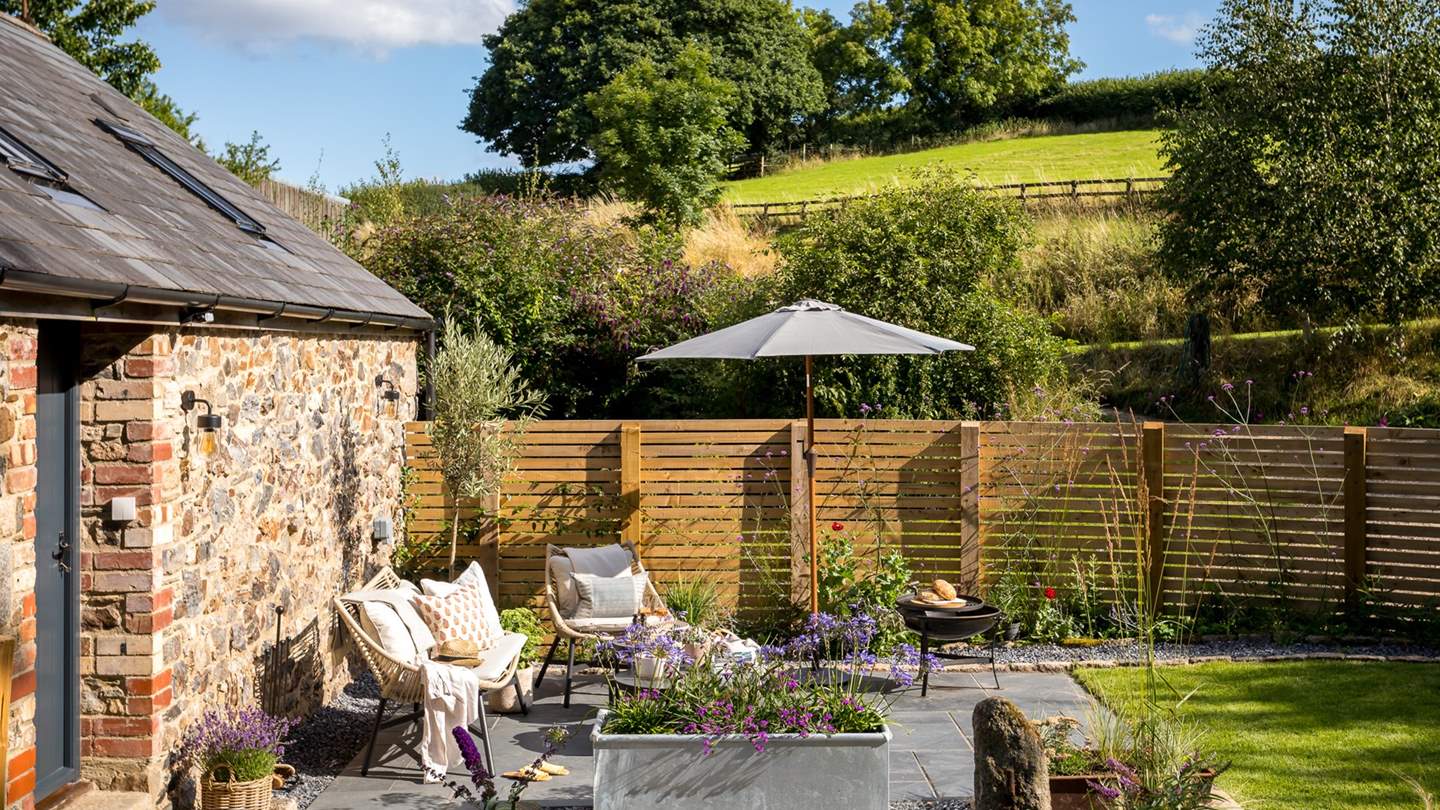 The enclosed garden promises a tranquil haven for moments of rest outdoors 