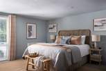 For moments of rest, retreat to the blissful bedroom, dressed in soothing shades of blue with Scandi furnishings. 