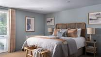 For moments of rest, retreat to the blissful bedroom, dressed in soothing shades of blue with Scandi furnishings. 