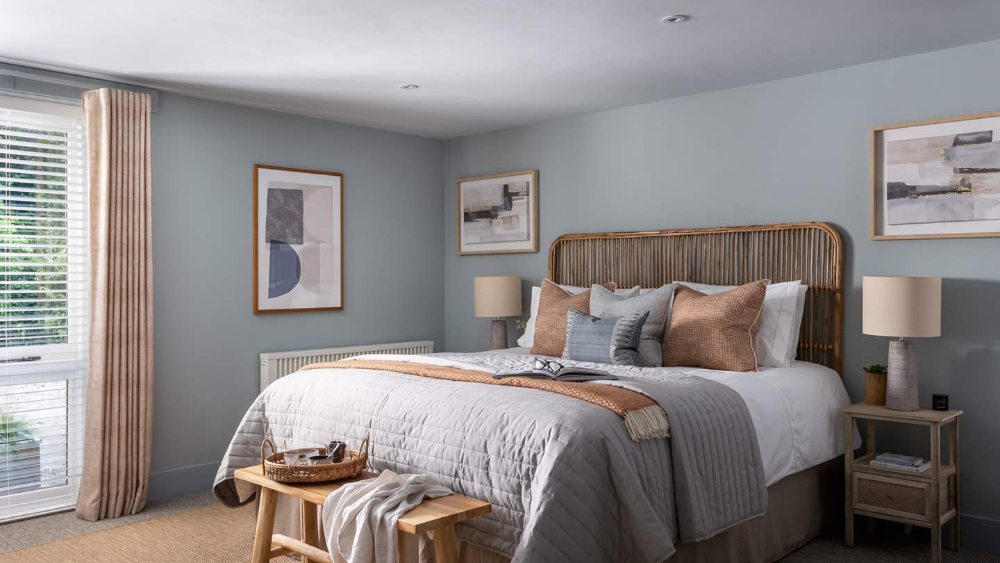 For moments of rest, retreat to the blissful bedroom, dressed in soothing shades of blue with Scandi furnishings. 