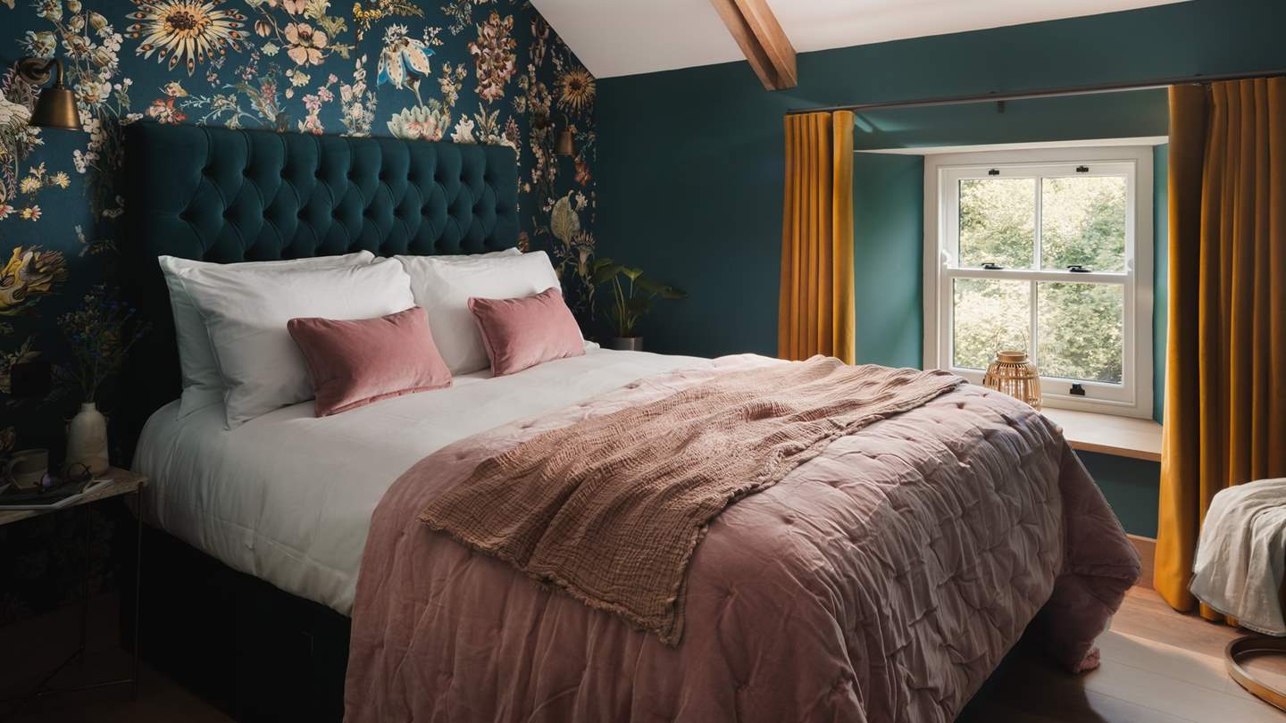 Botanical wallpaper and an original Victorian feature fireplace ensures the third bedroom is as equally enchanting... 