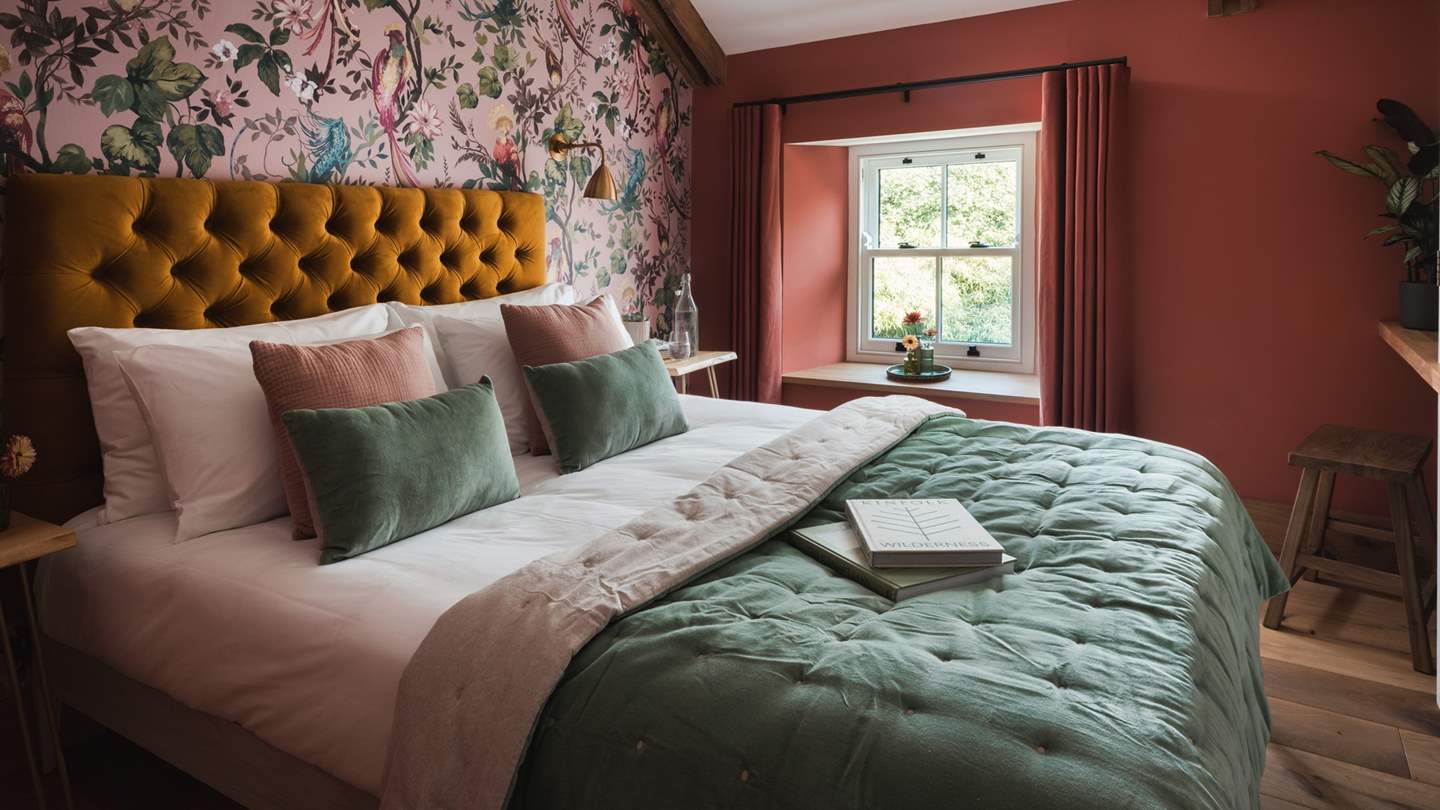 The second bedroom promises a symphony of jewel tones with powder-pink inflections