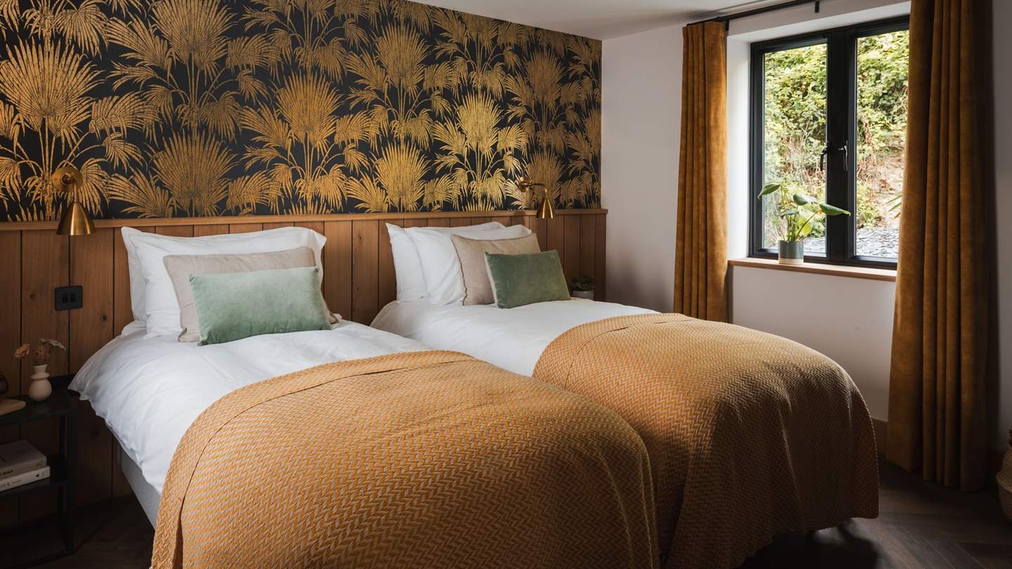 Radiant with golden hues and oak feature panelling, this bedroom is effortlessly luxurious...