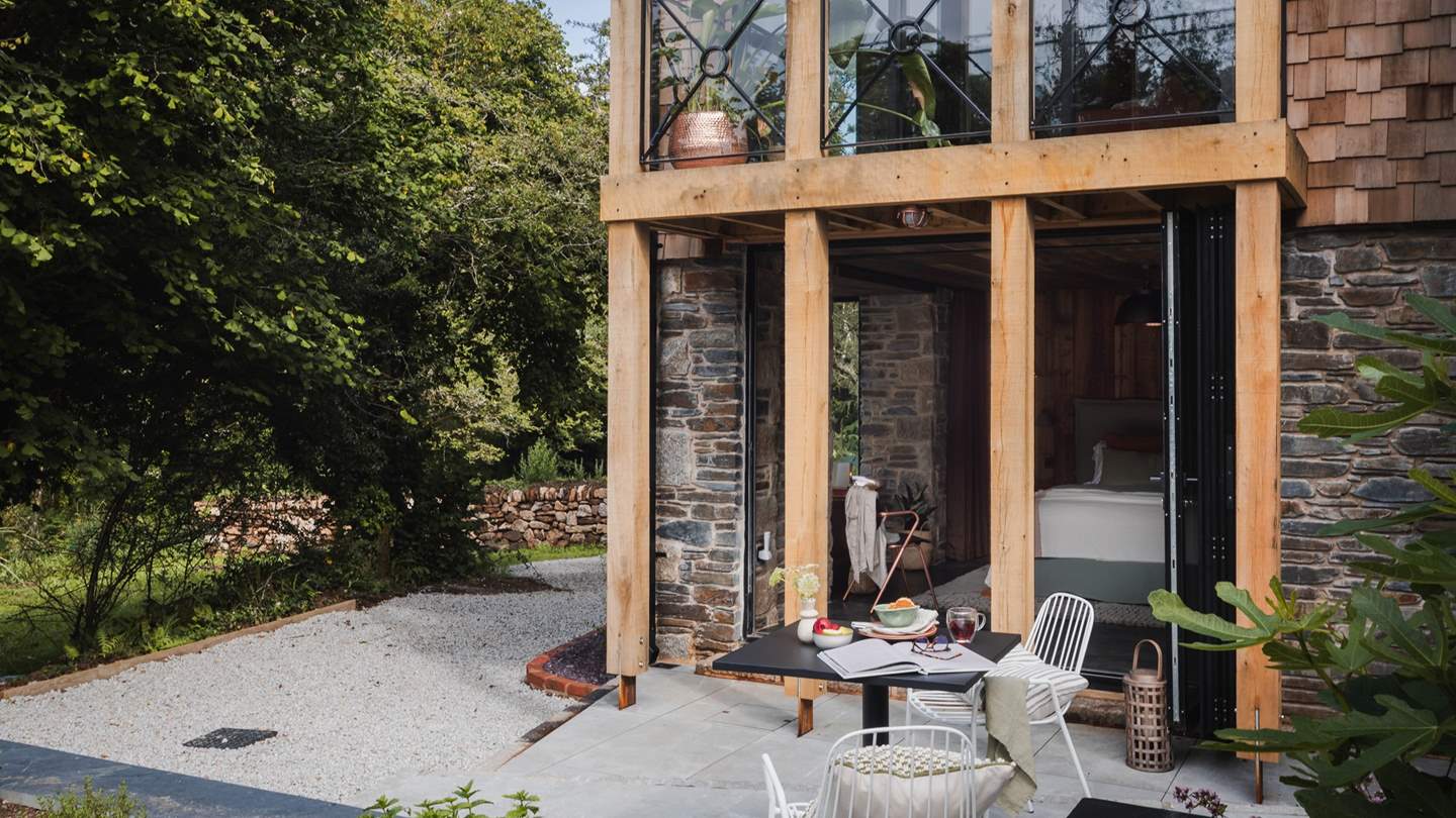 Adjacent to the bedroom is the patio, where a table with two chairs rests for morning lattes alfresco...