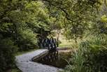 A meandering stream, feature pond and quirky bridge promising a fairytale setting like no other