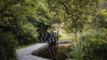 A meandering stream, feature pond and quirky bridge promising a fairytale setting like no other