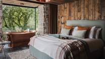The cabin-style master bedroom promises rustic charm throughout... 