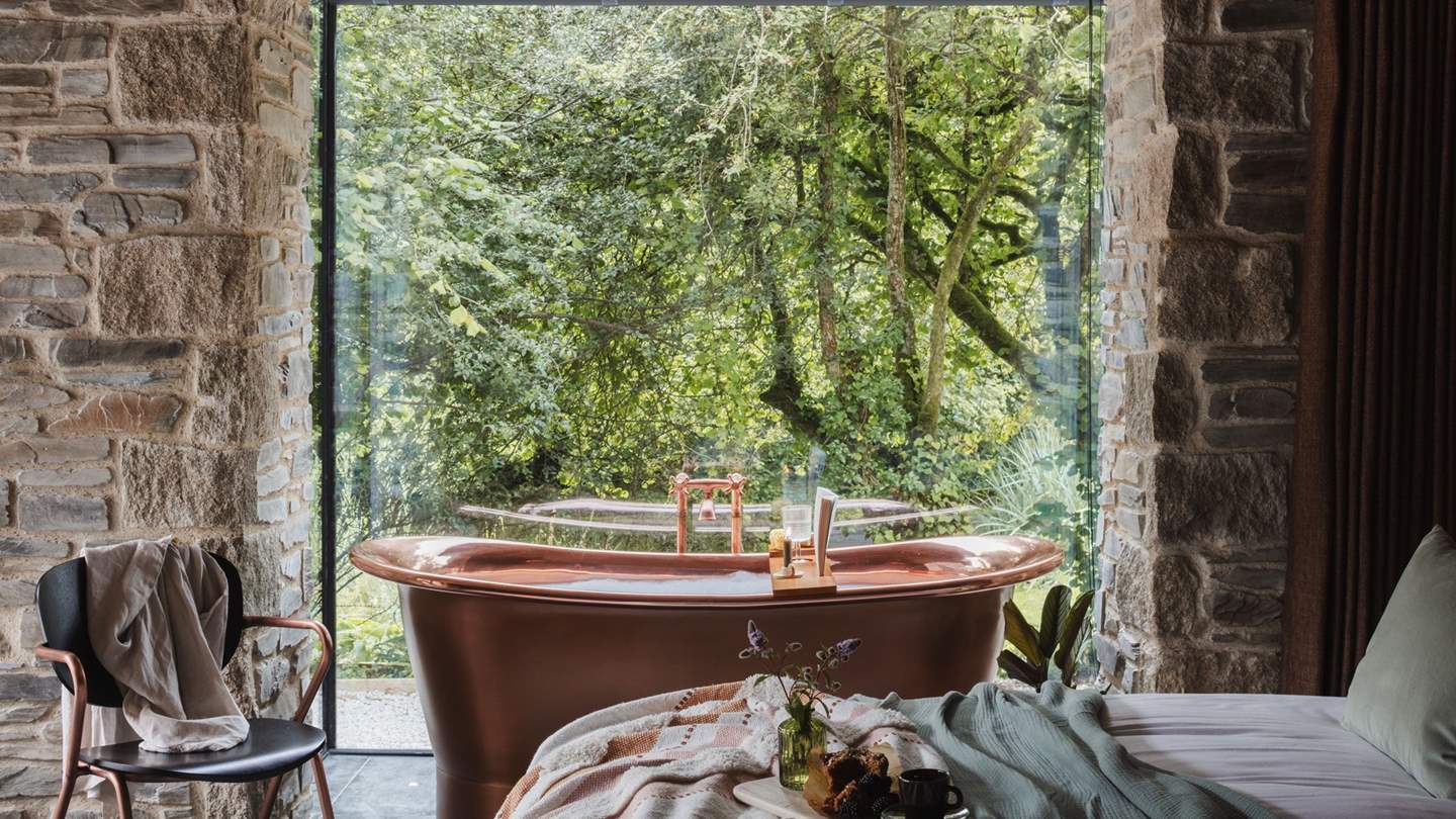 Uncover enchanting bubble-topped soaks in the copper bathtub...