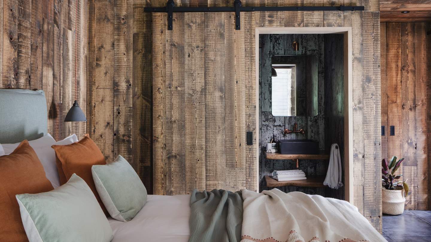 Hidden behind a sliding door is the gorgeous en suite bathroom