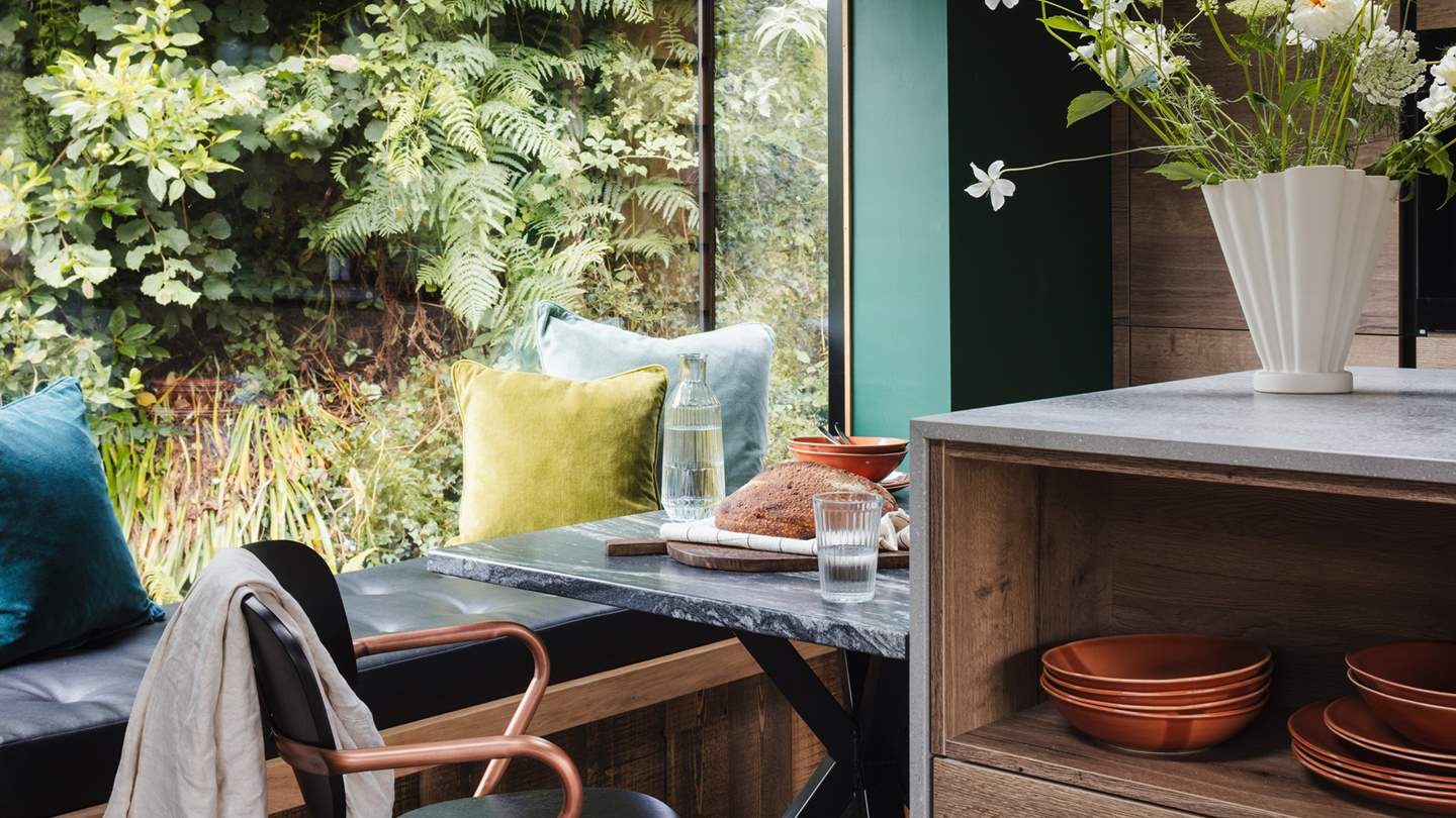 A marble-topped dining table sets the mood for romantic indoor dining