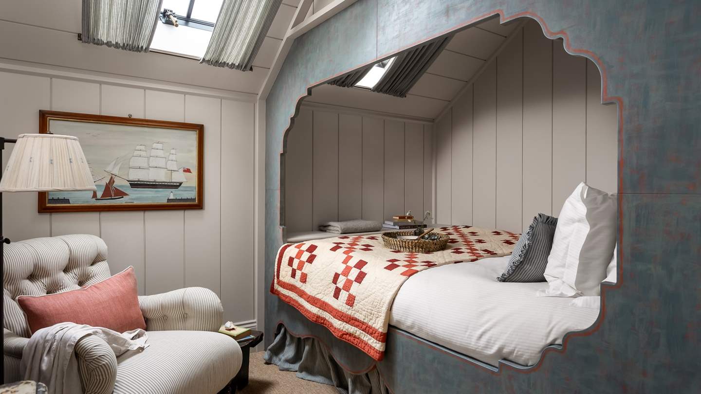 The master bedroom has a rich maritime theme, with a timber-clad Captain’s bed