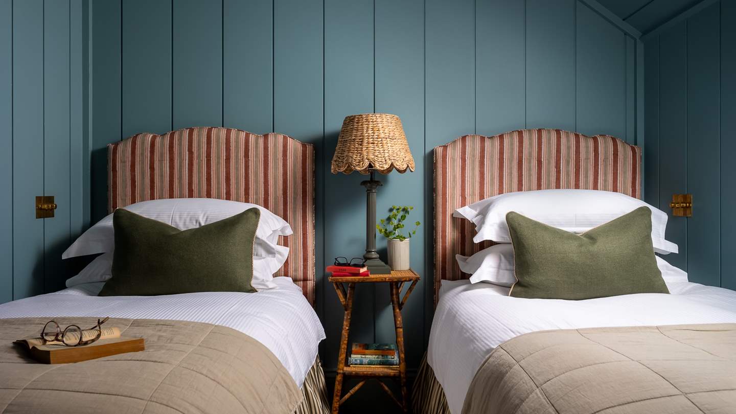 Soft blue panelled walls and ceiling continue the nautical theme of this former fisherman's net loft 