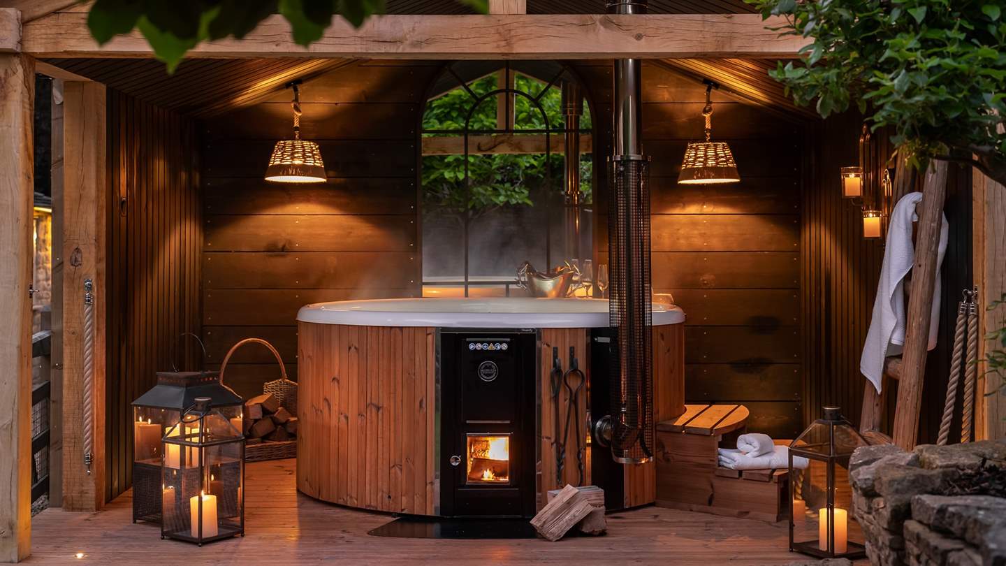For soothing dips at dusk, a wood-fired hot tub is nestled beneath a walled canopy for the utmost privacy