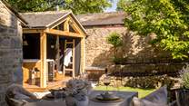 Step outside to uncover a beautiful dry stone walled garden