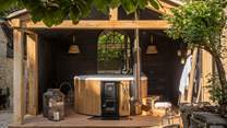 On sun-soaked days, relax in the garden, and take a dip in the hot tub