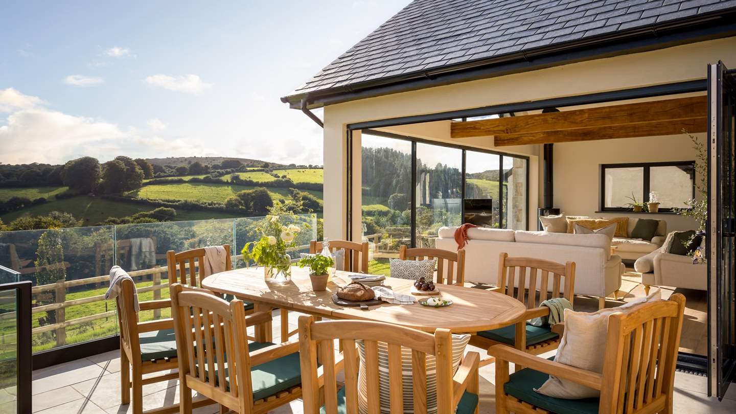 A well-positioned terrace overlooks the surrounding fields