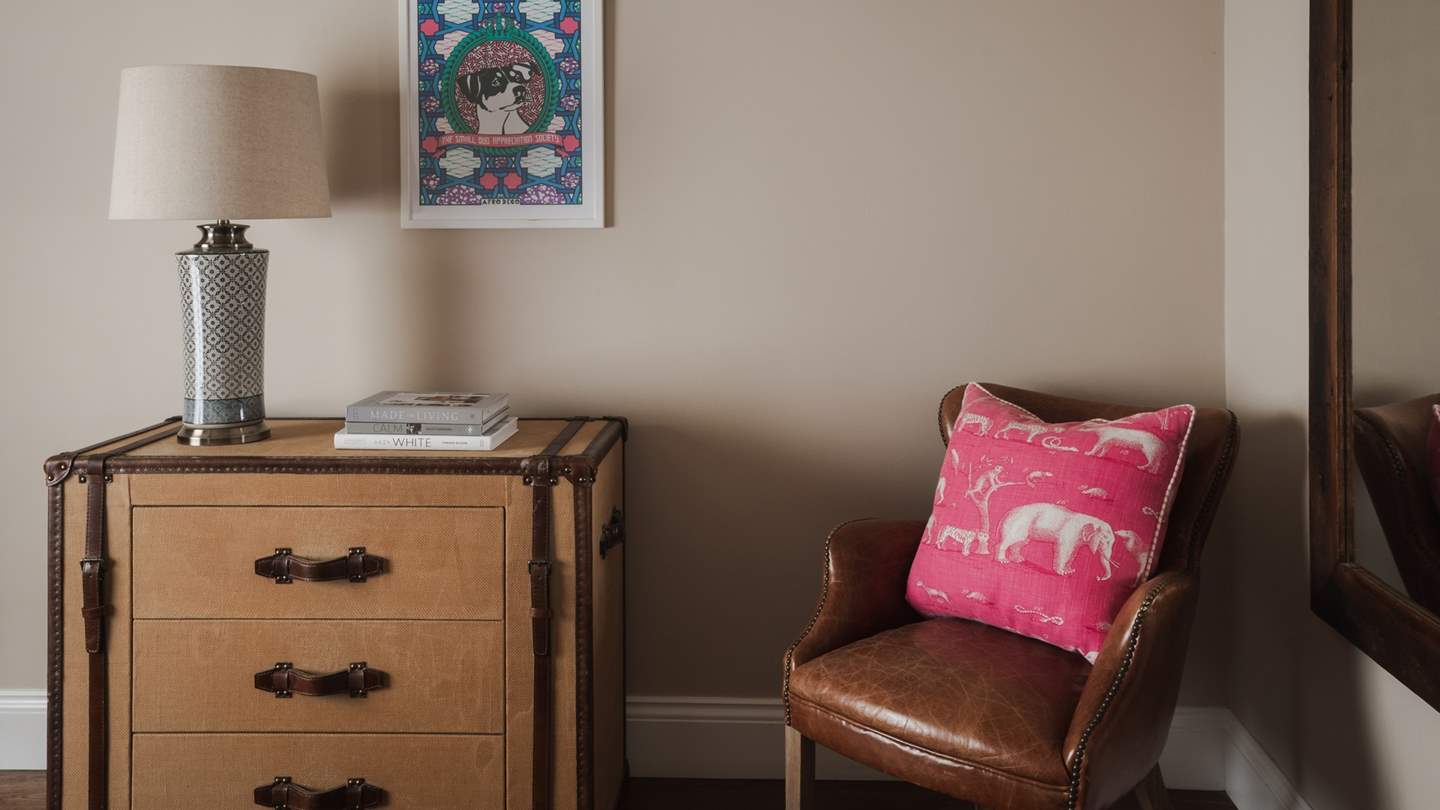A vintage chest of drawers offers a space to store your belongings...