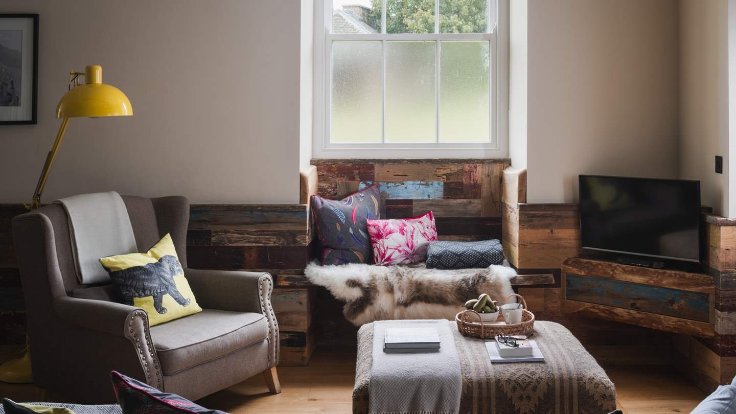 Seek afternoon sunlight in the cosy, sheepskin-draped window seat... 