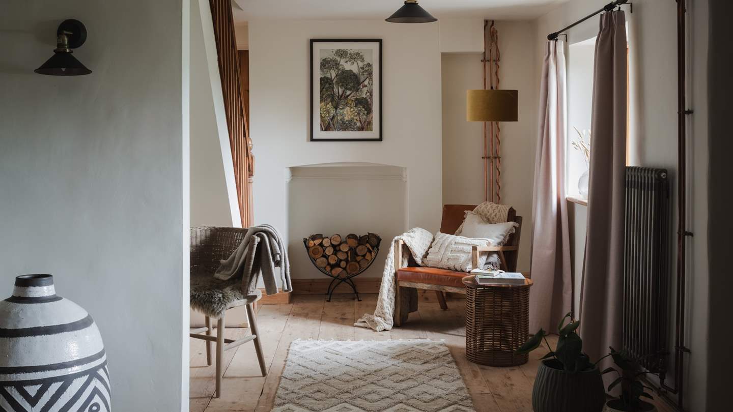At the opposite end of the living room, you'll find another tan leather armchair by Nkuku - a dreamy spot to snooze...