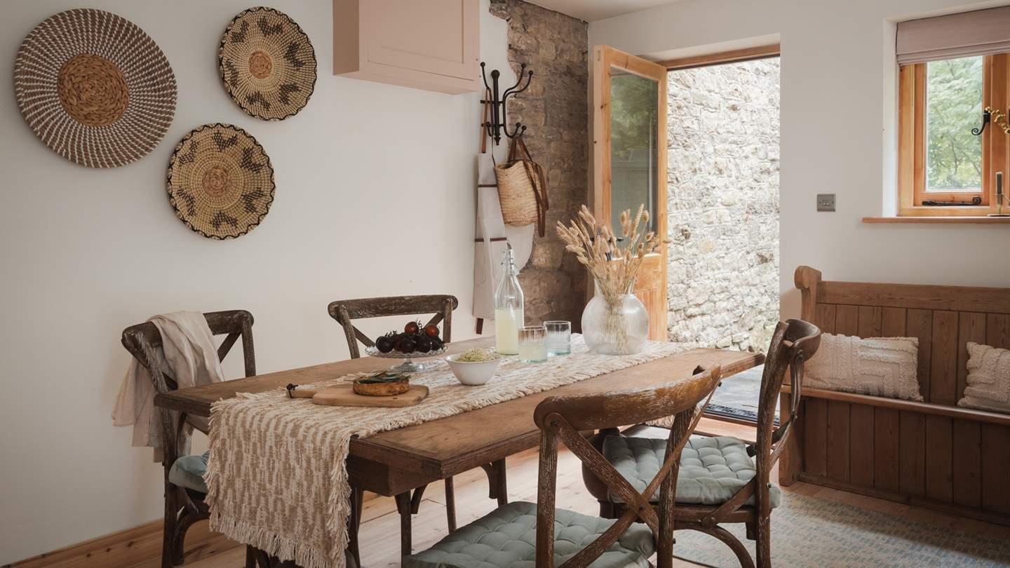 Step into the traditional country kitchen and dining space, complete with gorgeous antique furniture