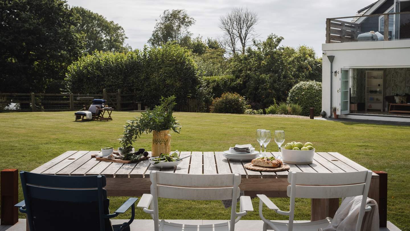 Meanwhile in front of the summerhouse a sun-kissed patio beckons for dreamy moments of alfresco living