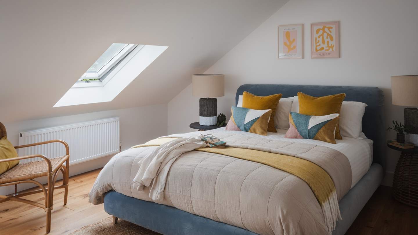 The final bedroom on the first floor is a tranquil oasis that imbues a soothing feel