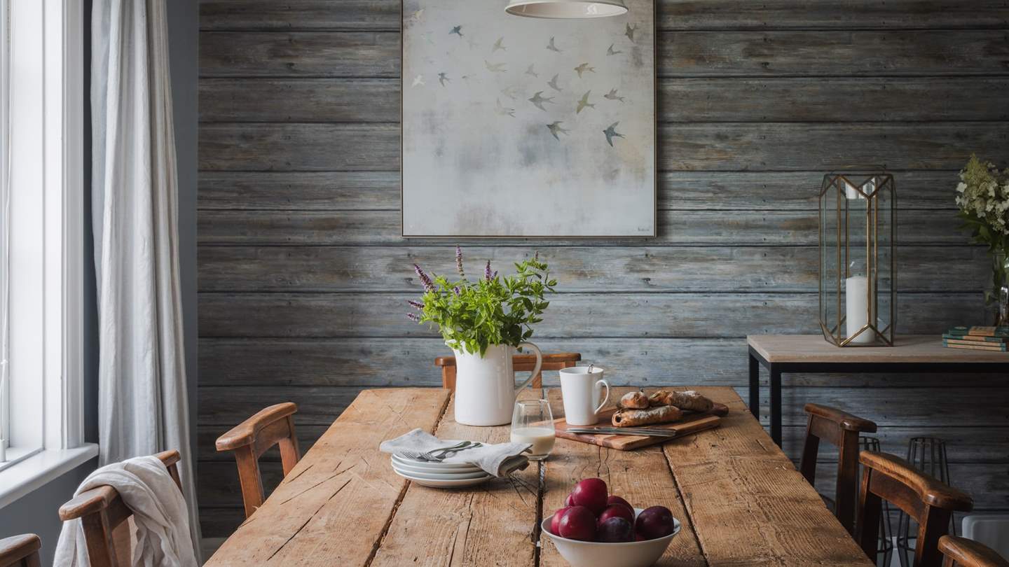 Centred around a farmhouse-style wood dining table, it provides seating for all the family to gather over delectable meals 
