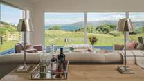 Enjoy the cinematic views from the large, floor-to-ceiling windows of Loch Dunvegan and the landscapes of the Outer Hebrides