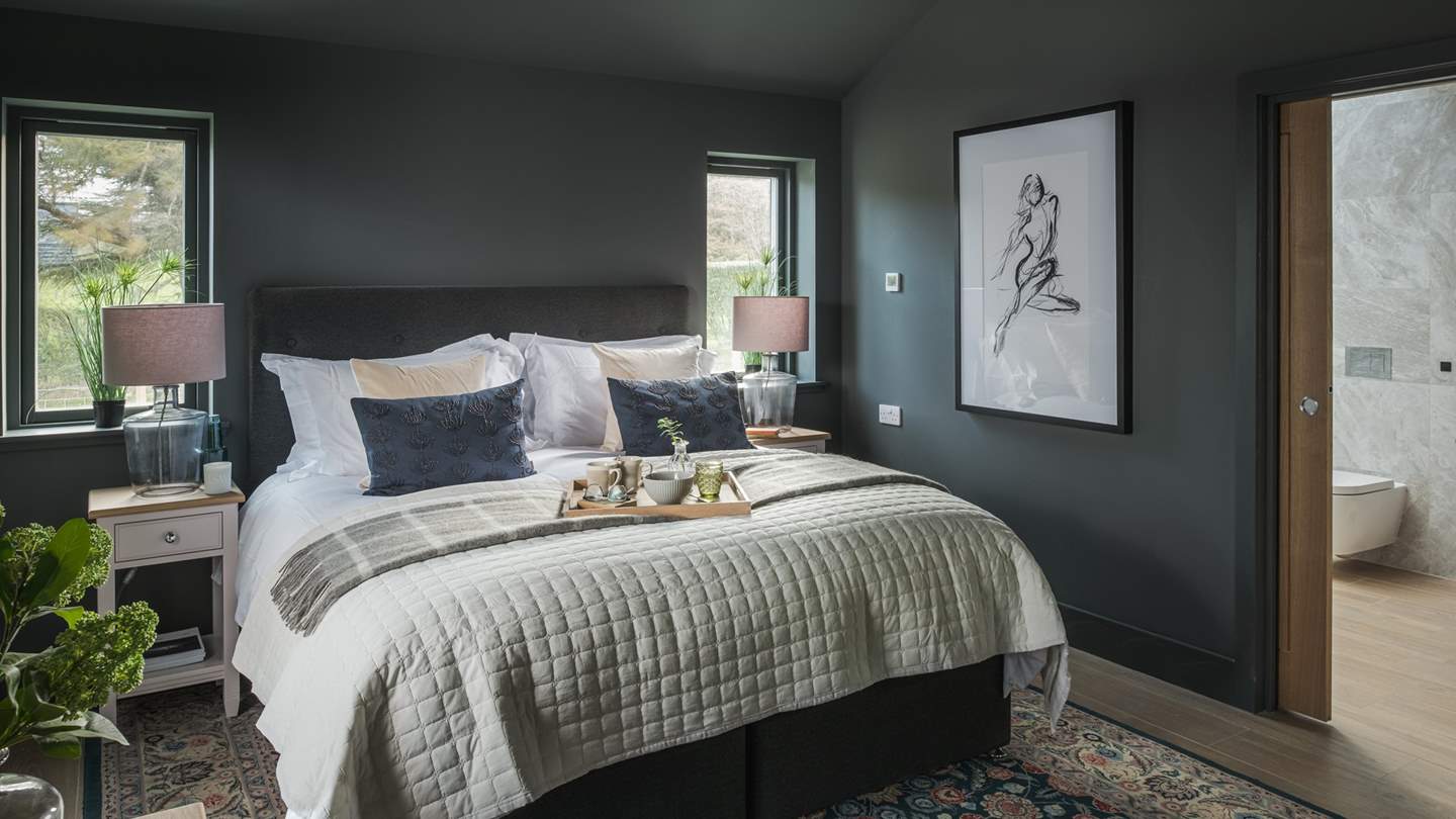 The sumptuous king-sized bed is topped with silky soft sheets... 