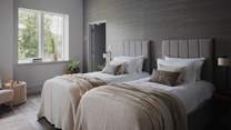 An equally calming space, the fourth bedroom offers flexible sleeping arrangements, with a zip-and-link super king bed 