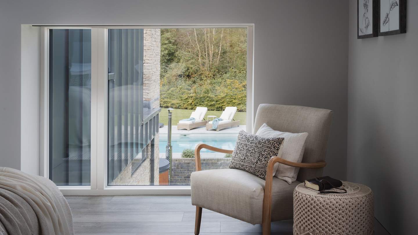 This room boasts views across the outdoor pool, igniting excitement for little ones eager to take a dip in the balmy cerulean water before them