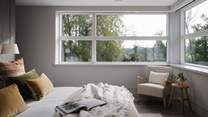 Should you wish to tear your eyes from the verdant vistas, you’ll also find a Smart TV, perfectly positioned to catch up on the morning’s news as you enjoy a lingering lie-in