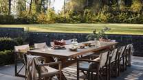 You'll also find a Green Egg barbeque and a large contemporary dining table, which comfortably seats eight