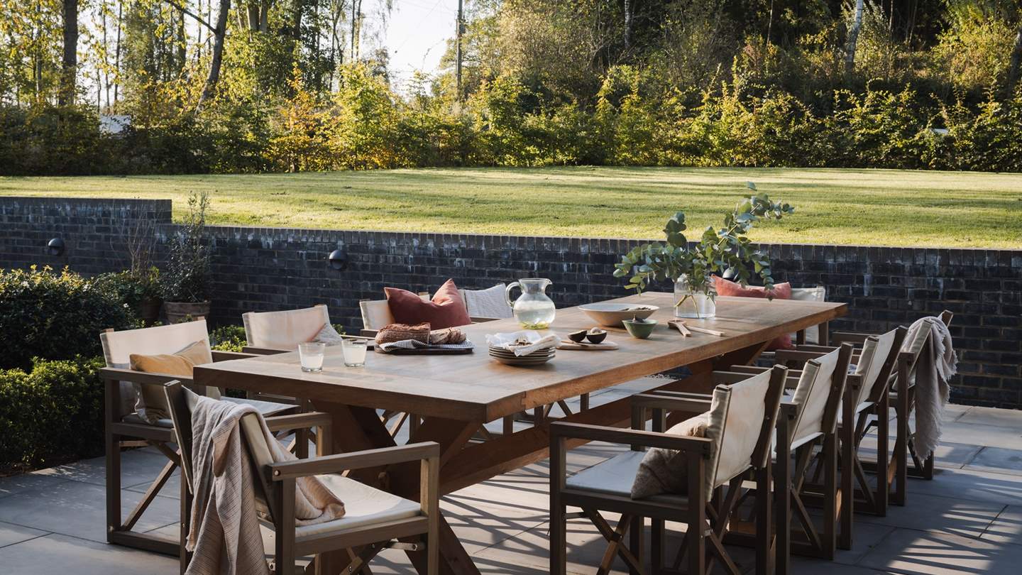 You'll also find a Green Egg barbeque and a large contemporary dining table, which comfortably seats eight