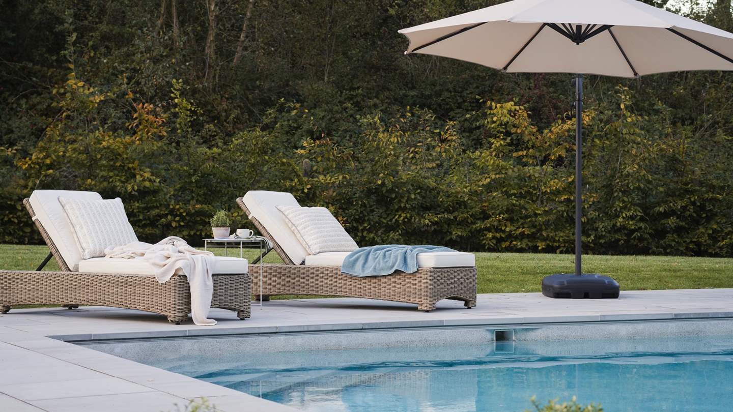 Seek relaxing moments poolside...