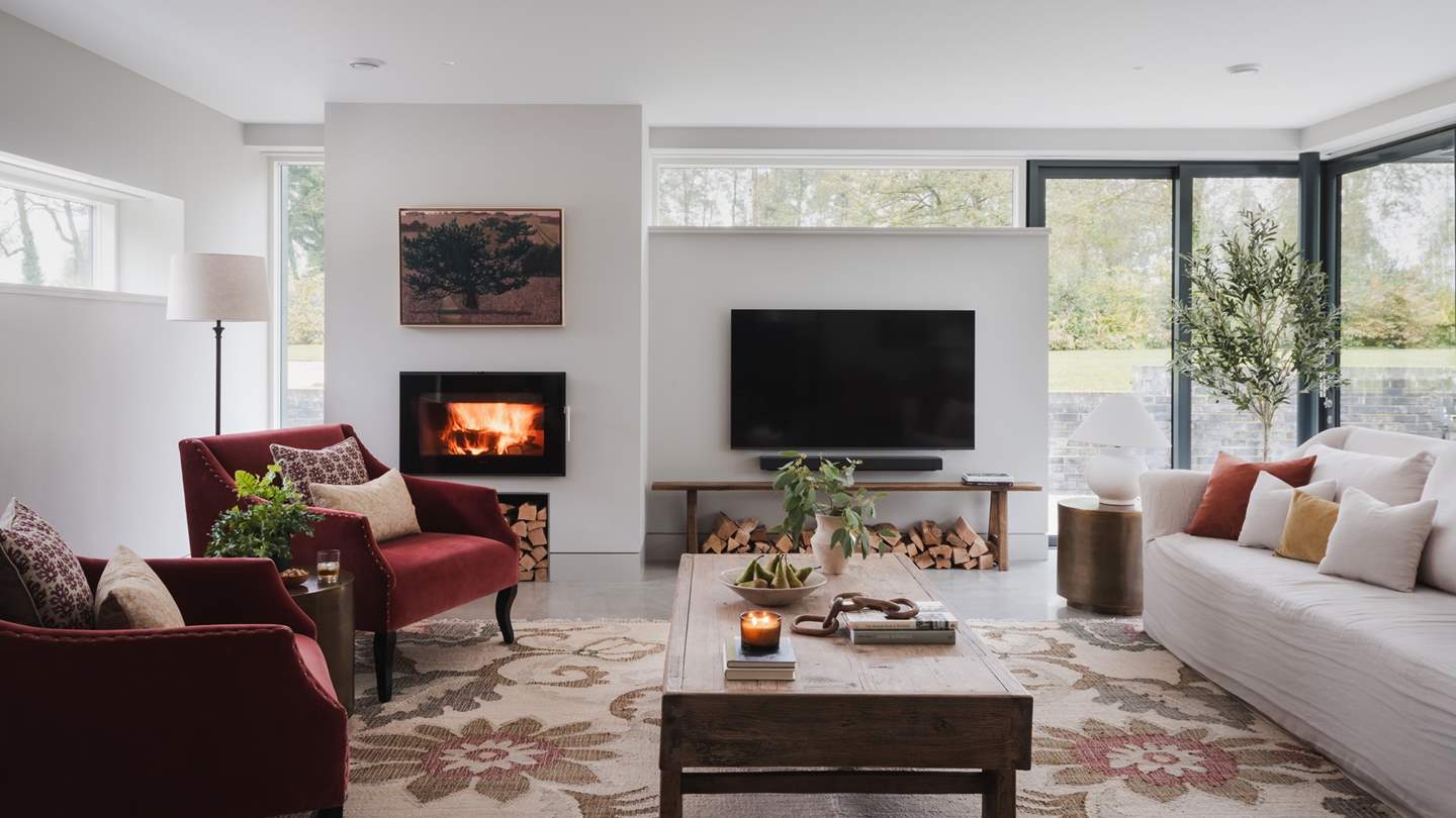 Settle in for snug evenings beside the Morso wood-burning stove