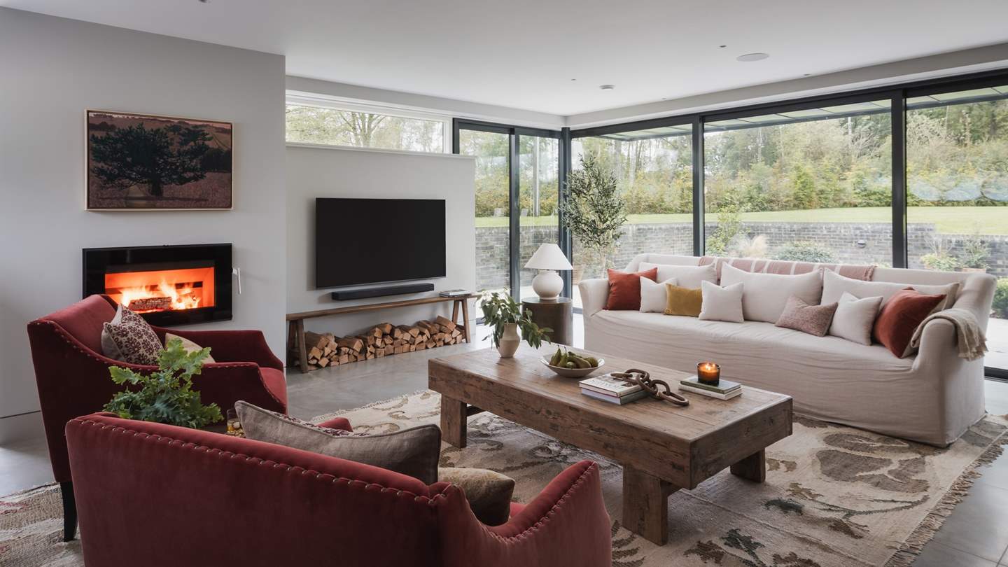 With views across the garden from the floor to ceiling windows, the lounge is a bright and airy space