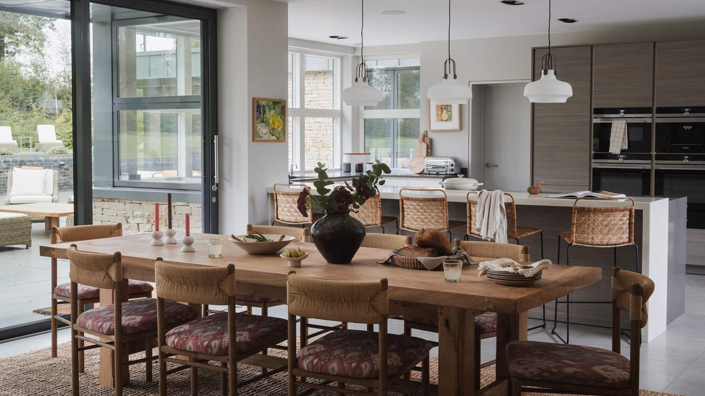 An inviting kitchen and dining space, designed to gather over shared feasts