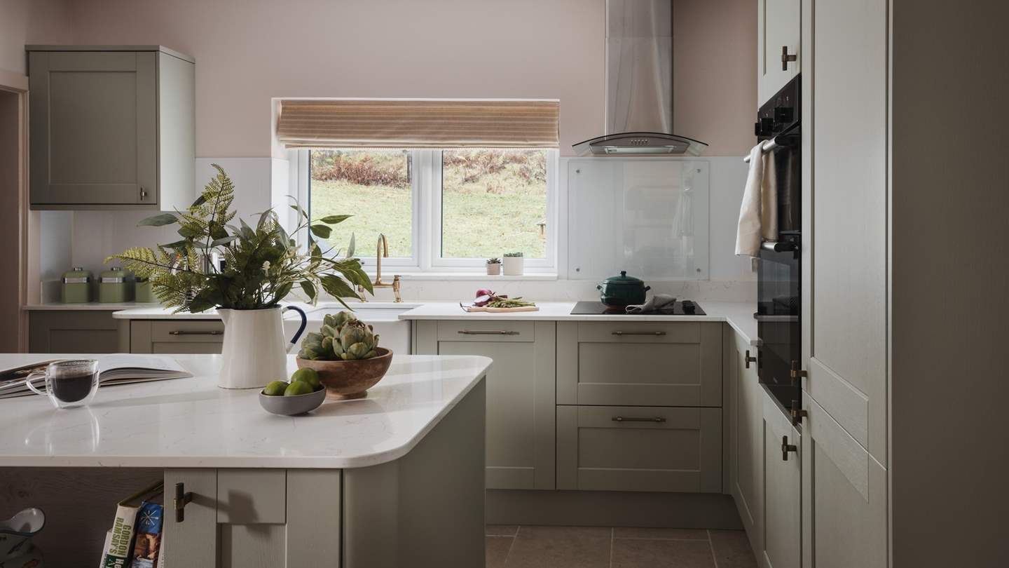 Cute and compact with a bespoke kitchen island, it cleverly incorporates an array of integrated appliances and useful additions