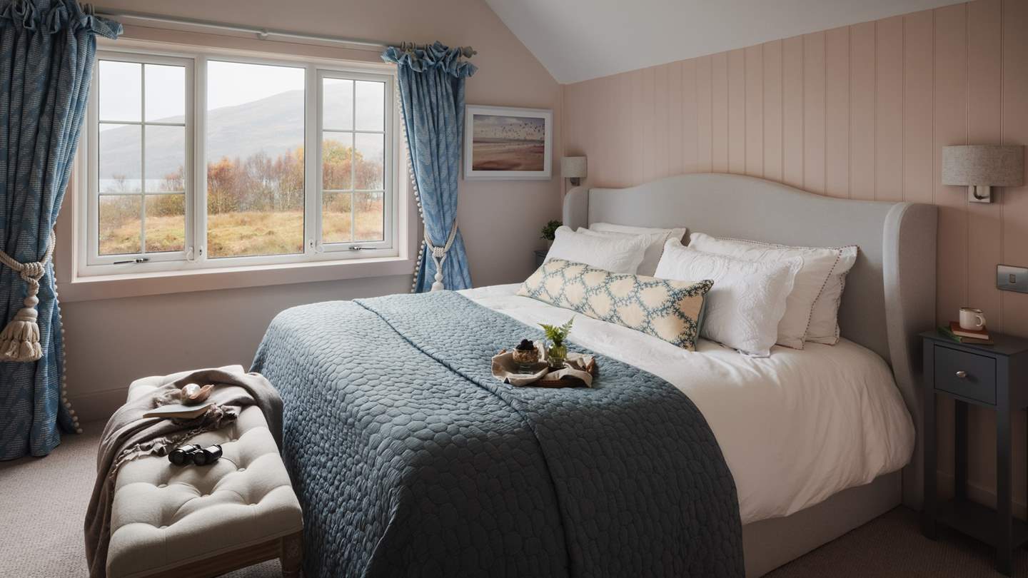 Delight in the wilderness vistas framed by large windows...